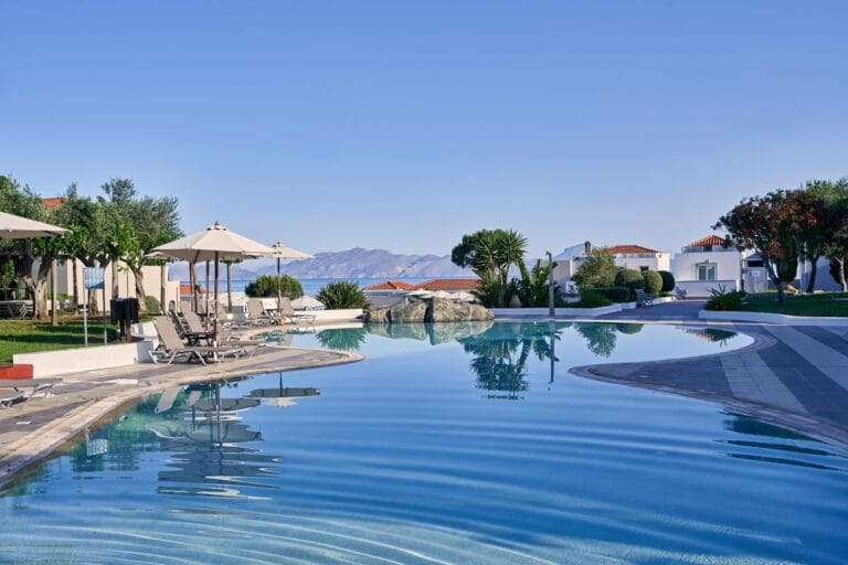 Infinity pool with mountain views and sun loungers